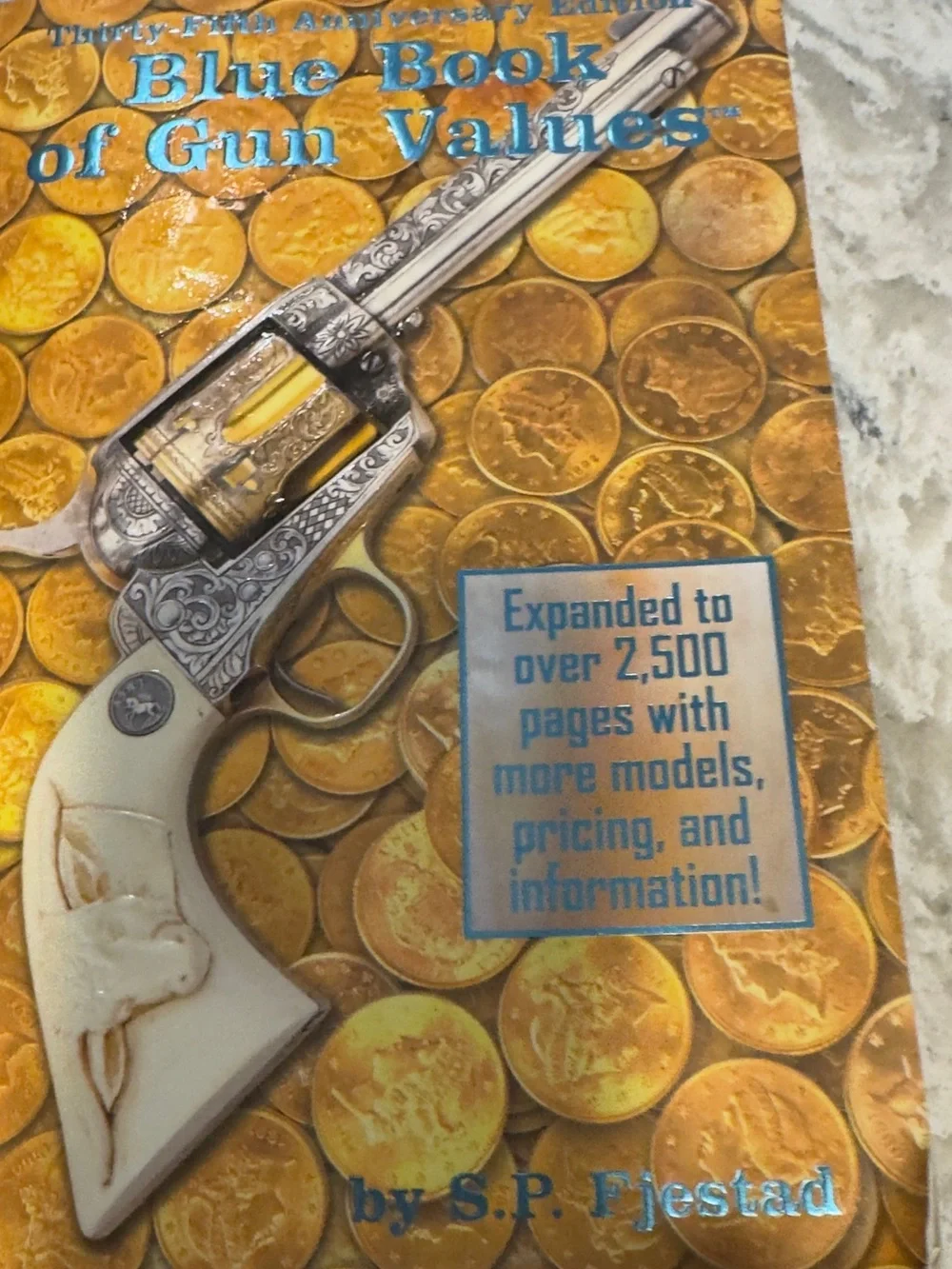 Firearms Reference Guide Book - Brown and Silver guns knive book
